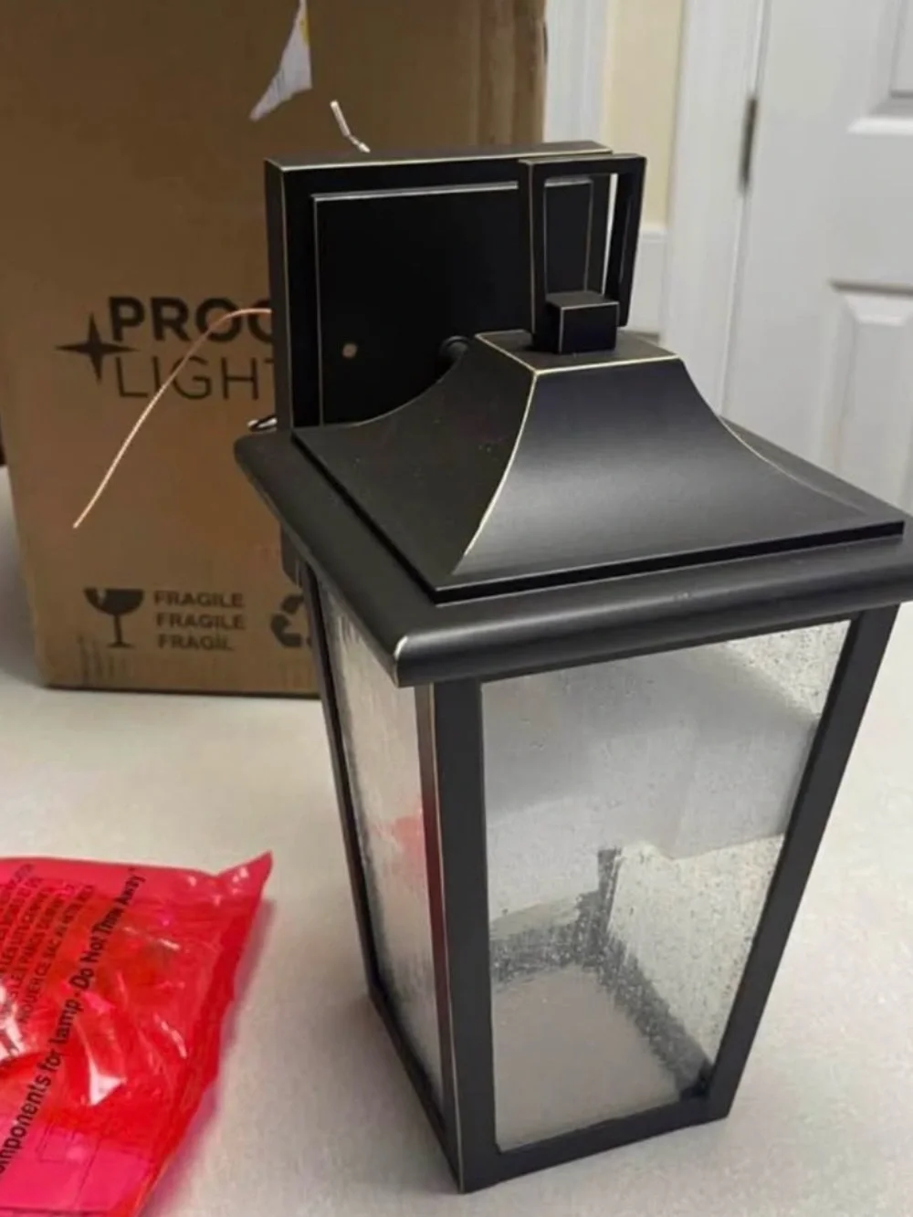 NWT Progress Lighting Padgett Bronze Seeded Glass Outdoor Wall Lantern